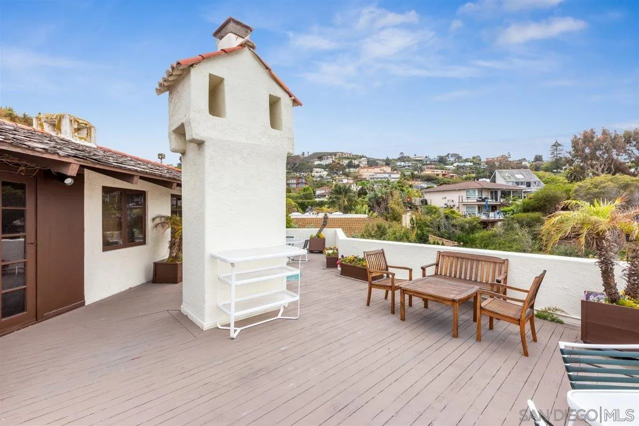 7944 Princess Street La Jolla, CA 92037 - Photo 29 of 39 a view of a patio with a table and chairs