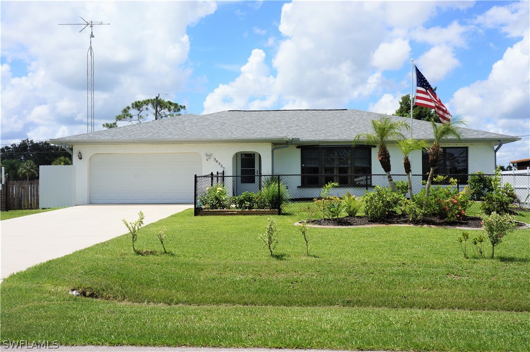 30337 Beech Road Punta Gorda, FL 33982 - Photo 1 of 33 a front view of a house with a yard