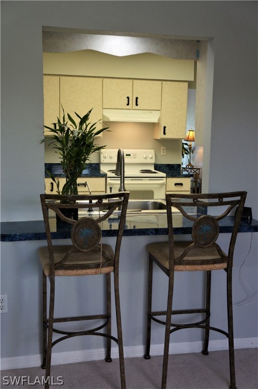 30337 Beech Road Punta Gorda, FL 33982 - Photo 23 of 33 a kitchen with a table and chairs in it