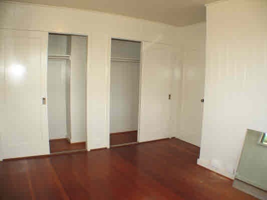 3521 Wailani Road Koloa, HI 96756 - Photo 8 of 17 an empty room with wooden floor and closet