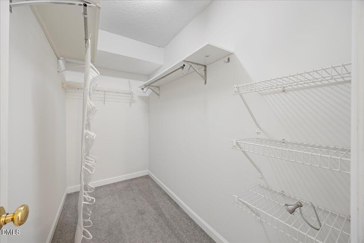 1101 Parkridge Lane, Unit 107 Raleigh, NC 27605 - Photo 21 of 33 a view of a room with racks on the wall