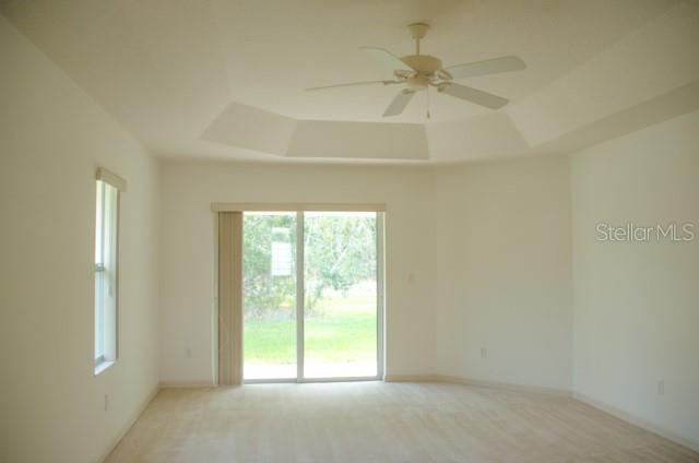 8 Eastland Lane Palm Coast, FL 32164 - Photo 14 of 60 an empty room with a window and a fan