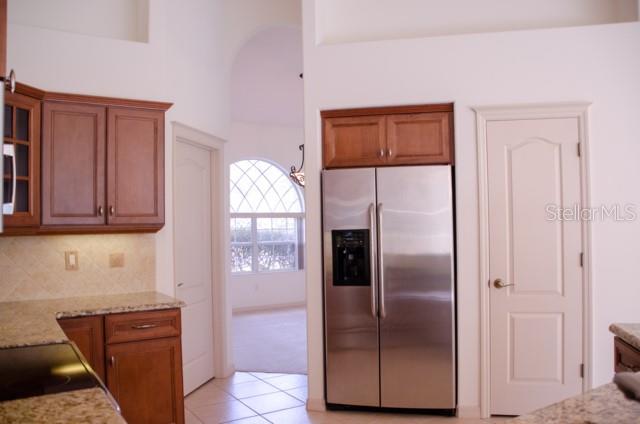 8 Eastland Lane Palm Coast, FL 32164 - Photo 23 of 60 a kitchen with stainless steel appliances granite countertop a refrigerator and a sink