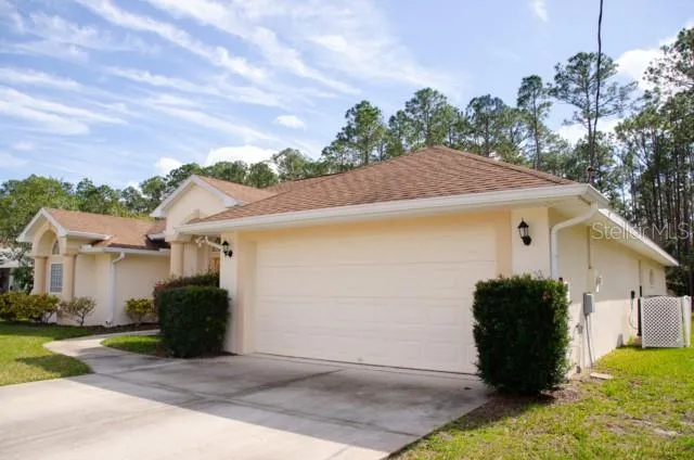 a view of a house with a garage