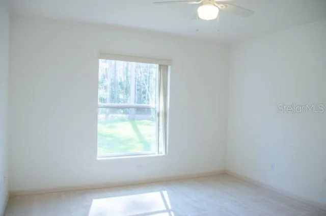 a white toilet sitting next to a white walls