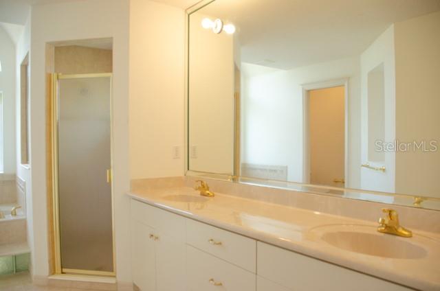 8 Eastland Lane Palm Coast, FL 32164 - Photo 44 of 60 a bathroom with a sink and a mirror