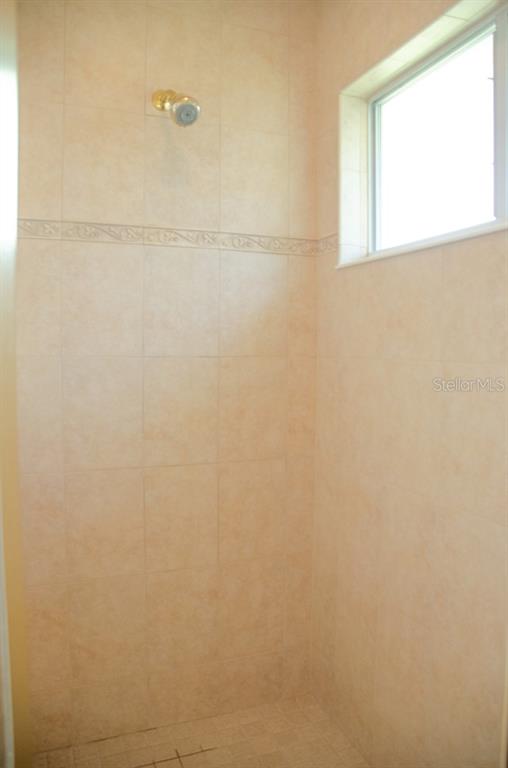 8 Eastland Lane Palm Coast, FL 32164 - Photo 47 of 60 a bathroom with a shower