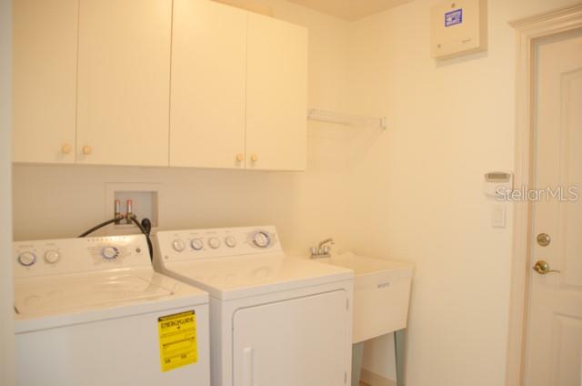 8 Eastland Lane Palm Coast, FL 32164 - Photo 50 of 60 a utility room with dryer and washer