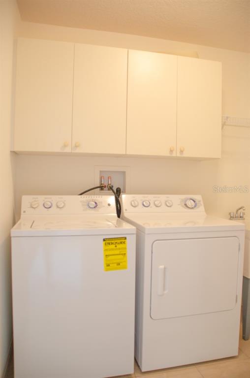 8 Eastland Lane Palm Coast, FL 32164 - Photo 51 of 60 a utility room with dryer and washer