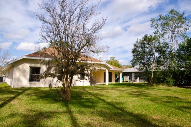 8 Eastland Lane Palm Coast, FL 32164 - Photo 55 of 60 a front view of a house with garden