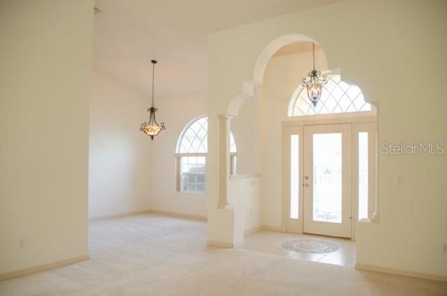 8 Eastland Lane Palm Coast, FL 32164 - Photo 6 of 60 a view of a room that has a window and wooden floor