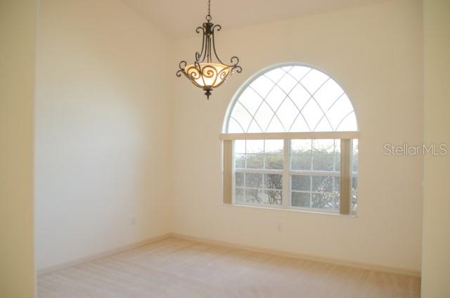 8 Eastland Lane Palm Coast, FL 32164 - Photo 7 of 60 an empty room with windows