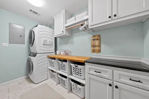 a utility room with cabinets