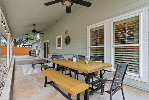 a dining room with a table and chairs