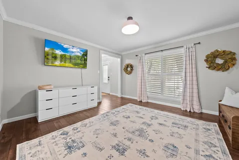 a bedroom with a bed and a dresser