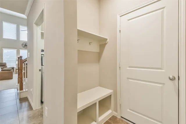 a dining room with furniture and a window