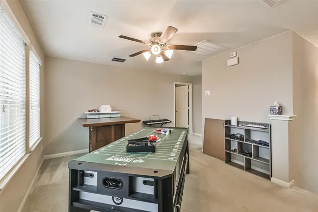 a kitchen with a stove and a chandelier