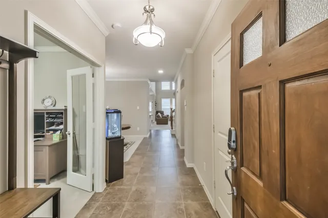 a view of a hallway view with wooden floor and living room