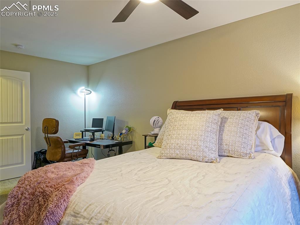4792 Kerry Lynn View Colorado Springs, CO 80922 - Photo 17 of 31 a bedroom with a bed and teddy bear on dresser