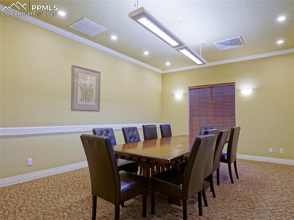 4792 Kerry Lynn View Colorado Springs, CO 80922 - Photo 28 of 31 a view of a dining room with furniture