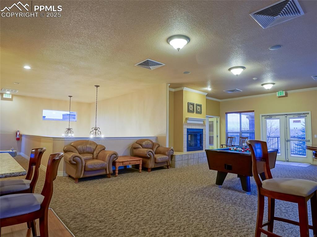 4792 Kerry Lynn View Colorado Springs, CO 80922 - Photo 28 of 34 a living room with furniture window and a table