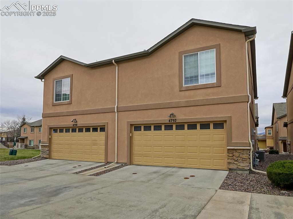 4792 Kerry Lynn View Colorado Springs, CO 80922 - Photo 3 of 34 a view of a house with garage