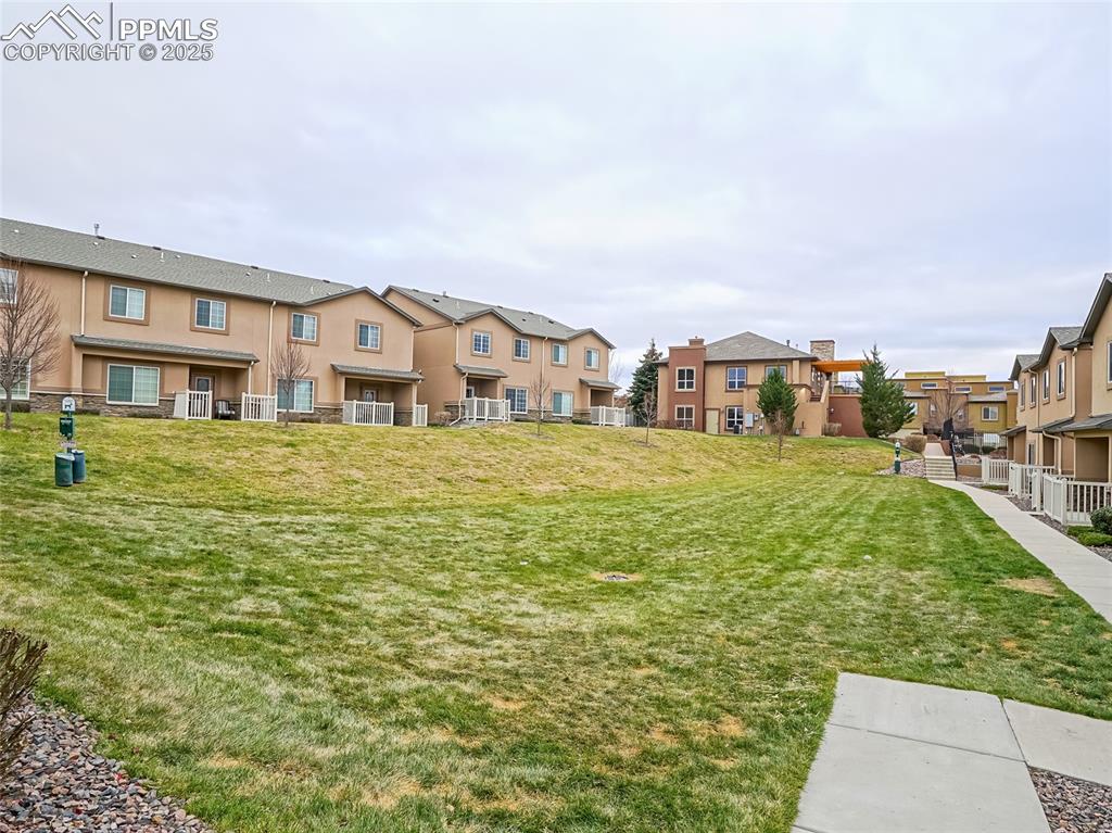 4792 Kerry Lynn View Colorado Springs, CO 80922 - Photo 32 of 34 a view of residential houses with yard and city view