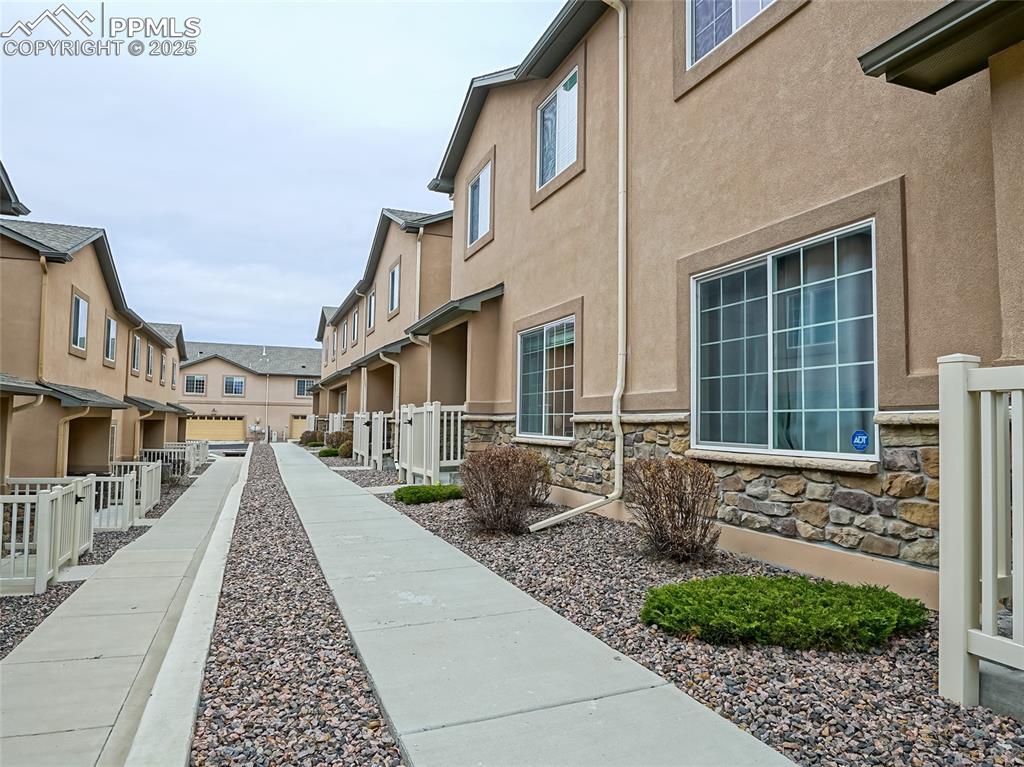 4792 Kerry Lynn View Colorado Springs, CO 80922 - Photo 33 of 34 a front view of a house with glass windows