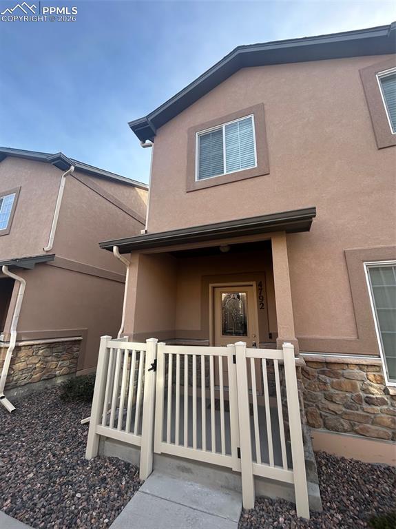 4792 Kerry Lynn View Colorado Springs, CO 80922 - Photo 34 of 34 a back view of a house with a small porch