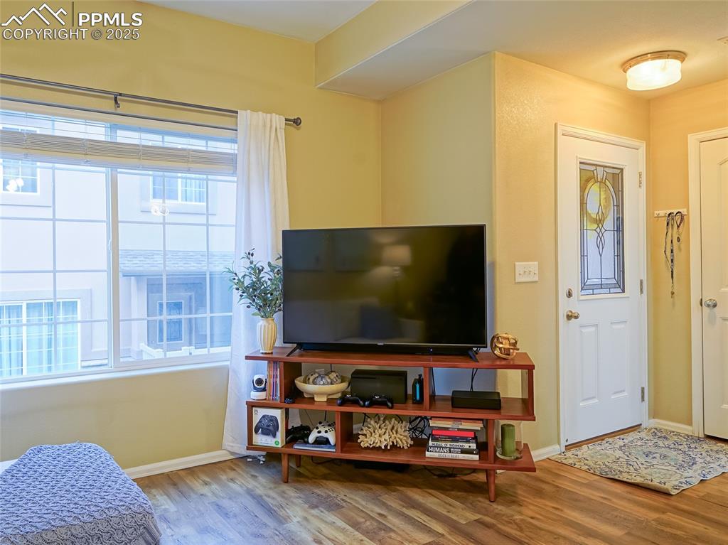 4792 Kerry Lynn View Colorado Springs, CO 80922 - Photo 4 of 31 a living room with furniture and flat screen tv