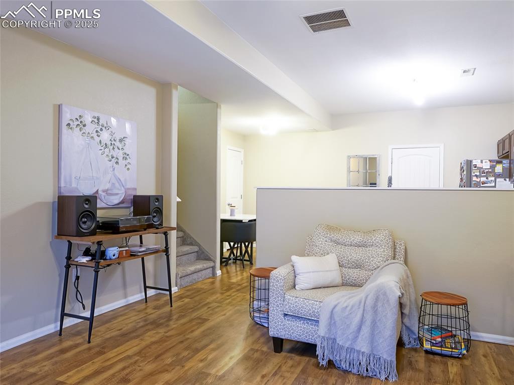 4792 Kerry Lynn View Colorado Springs, CO 80922 - Photo 8 of 34 a living room with furniture and wooden floor