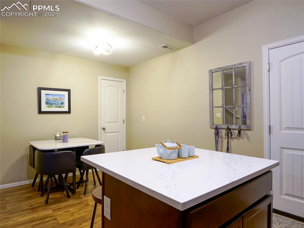4792 Kerry Lynn View Colorado Springs, CO 80922 - Photo 10 of 34 a view of a dining room with a table and chairs
