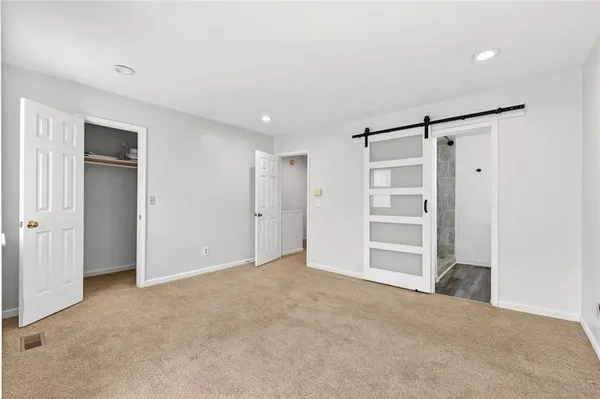 a view of an empty room with a cabinet