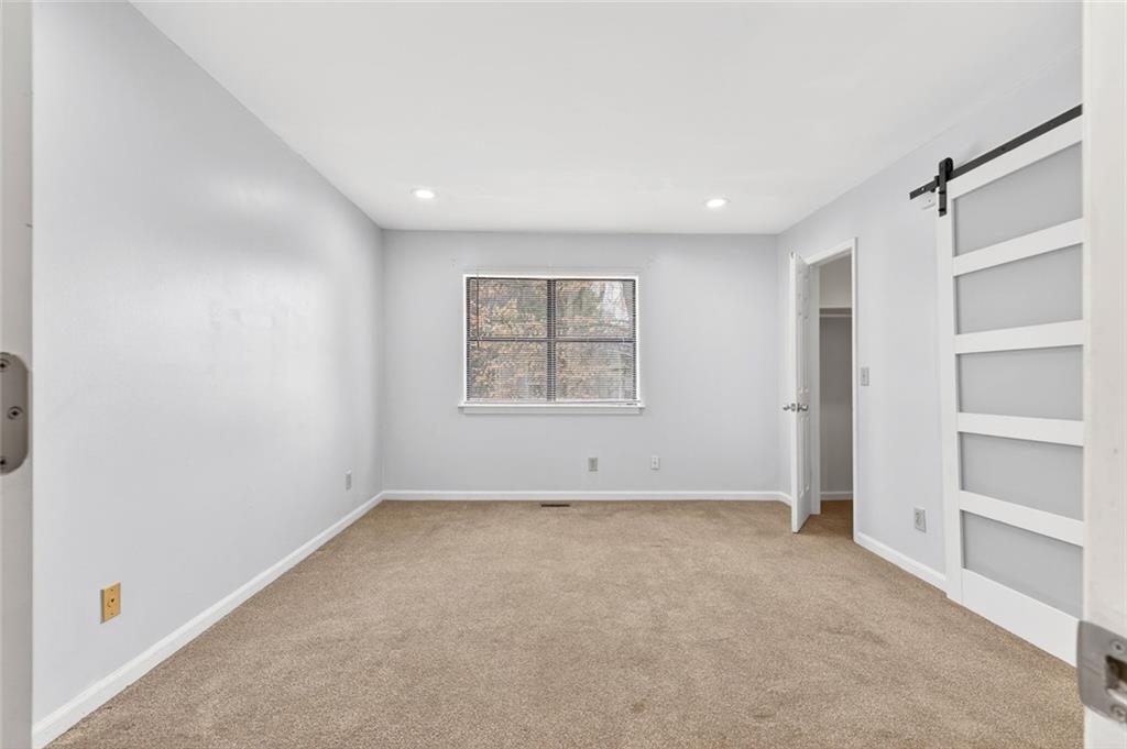 2226 Spring Walk Court Atlanta, GA 30341 - Photo 15 of 28 a view of an empty room with a window