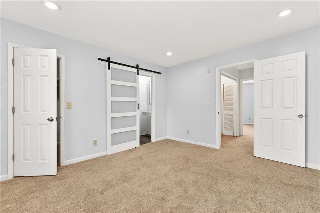 2226 Spring Walk Court Atlanta, GA 30341 - Photo 17 of 28 a view of an empty room with a closet