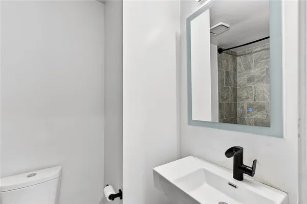 a bathroom with a sink and mirror