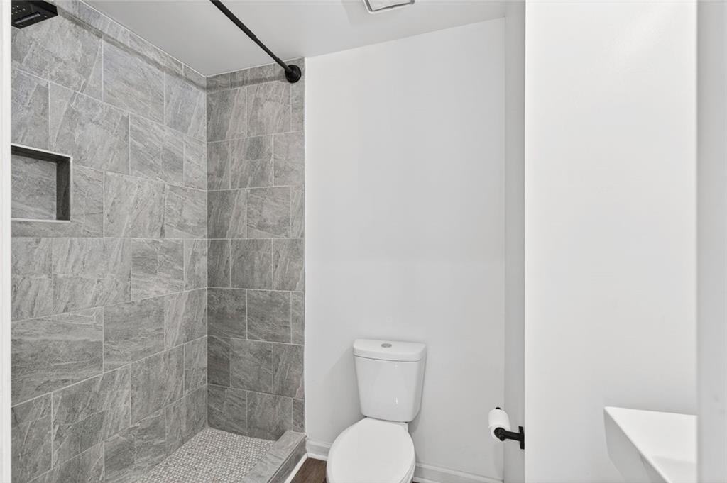 2226 Spring Walk Court Atlanta, GA 30341 - Photo 20 of 28 a bathroom with a toilet and a shower