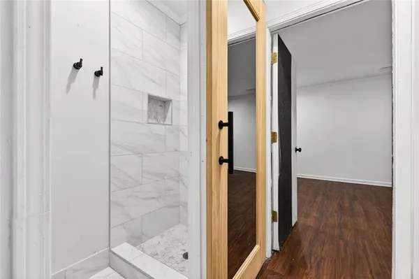 a bathroom with a glass shower door