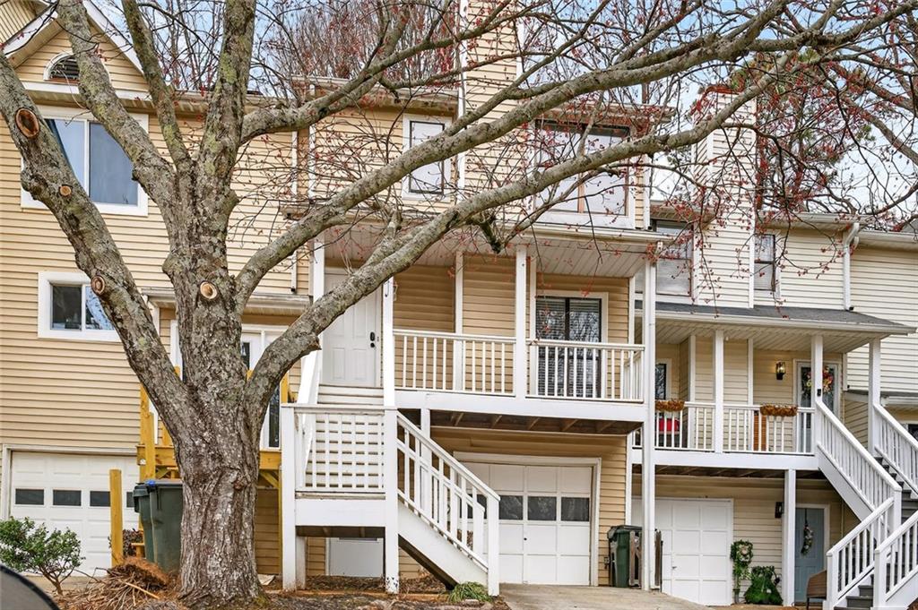 2226 Spring Walk Court Atlanta, GA 30341 - Photo 28 of 28 a front view of a building with a tree