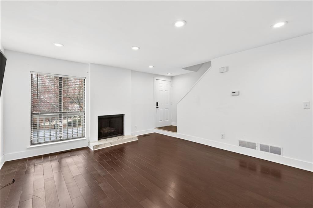 2226 Spring Walk Court Atlanta, GA 30341 - Photo 4 of 28 an empty room with wooden floor and windows