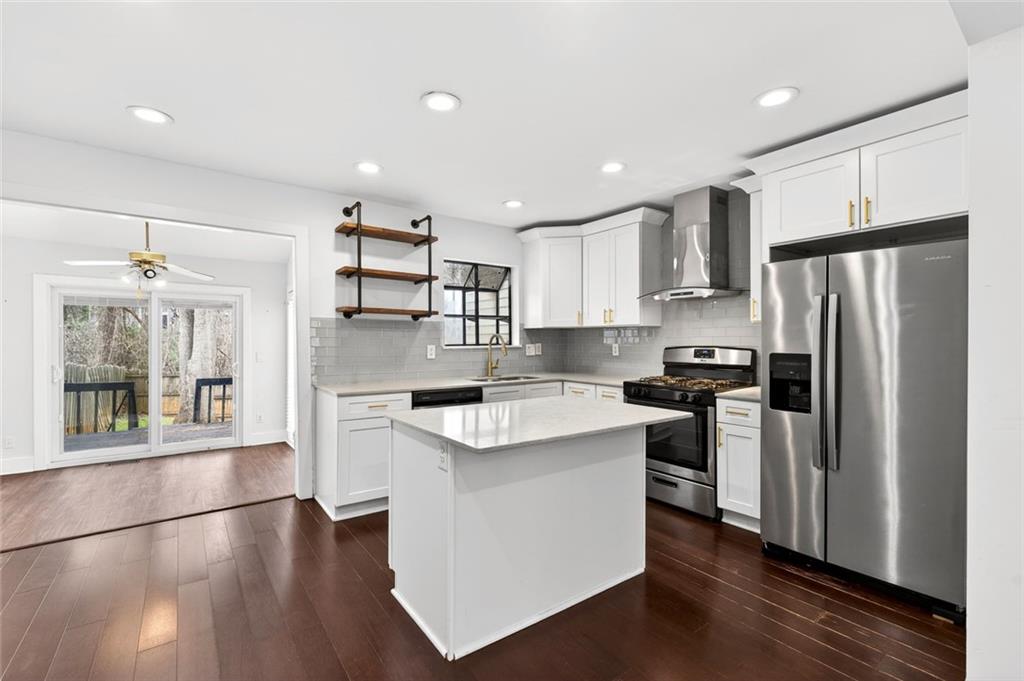 2226 Spring Walk Court Atlanta, GA 30341 - Photo 6 of 28 a kitchen with stainless steel appliances granite countertop a refrigerator a sink dishwasher a stove and a refrigerator