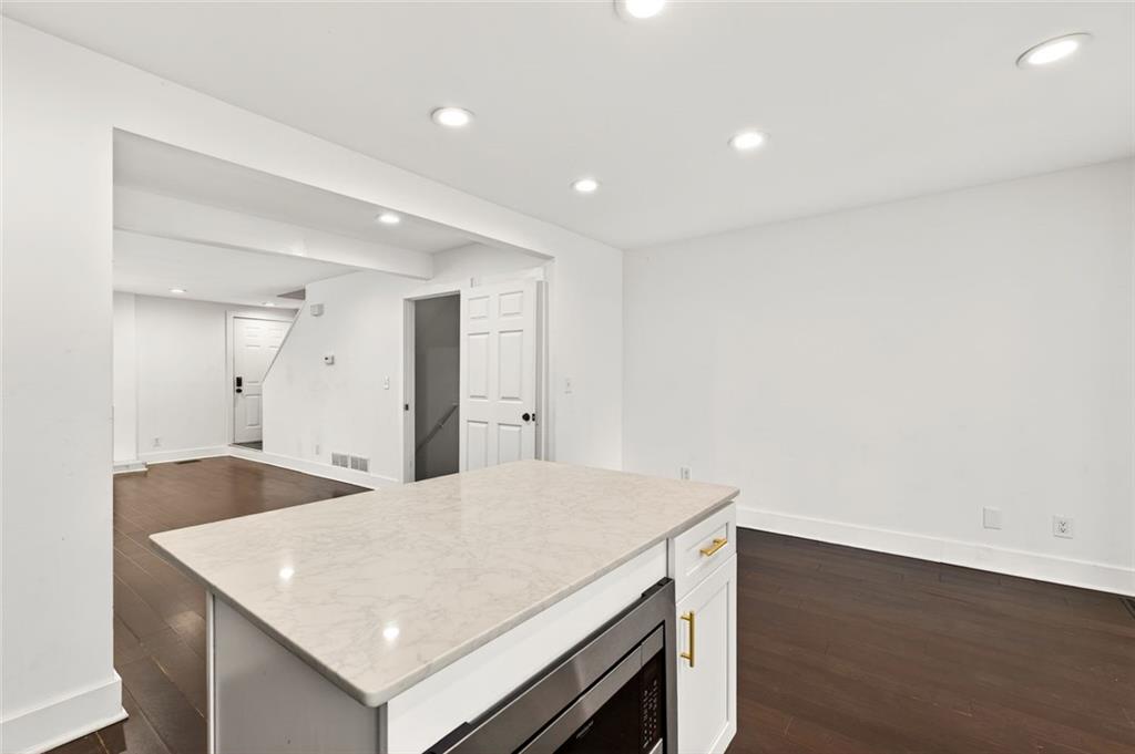 2226 Spring Walk Court Atlanta, GA 30341 - Photo 7 of 28 a kitchen with a sink a microwave and cabinets