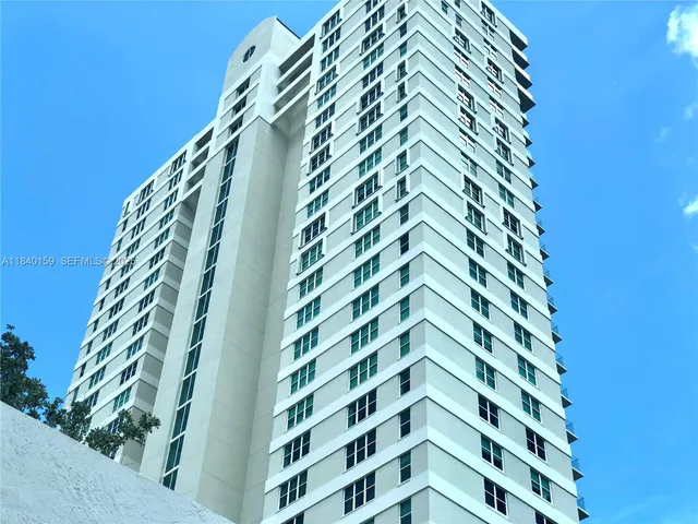 a view of water with tall building