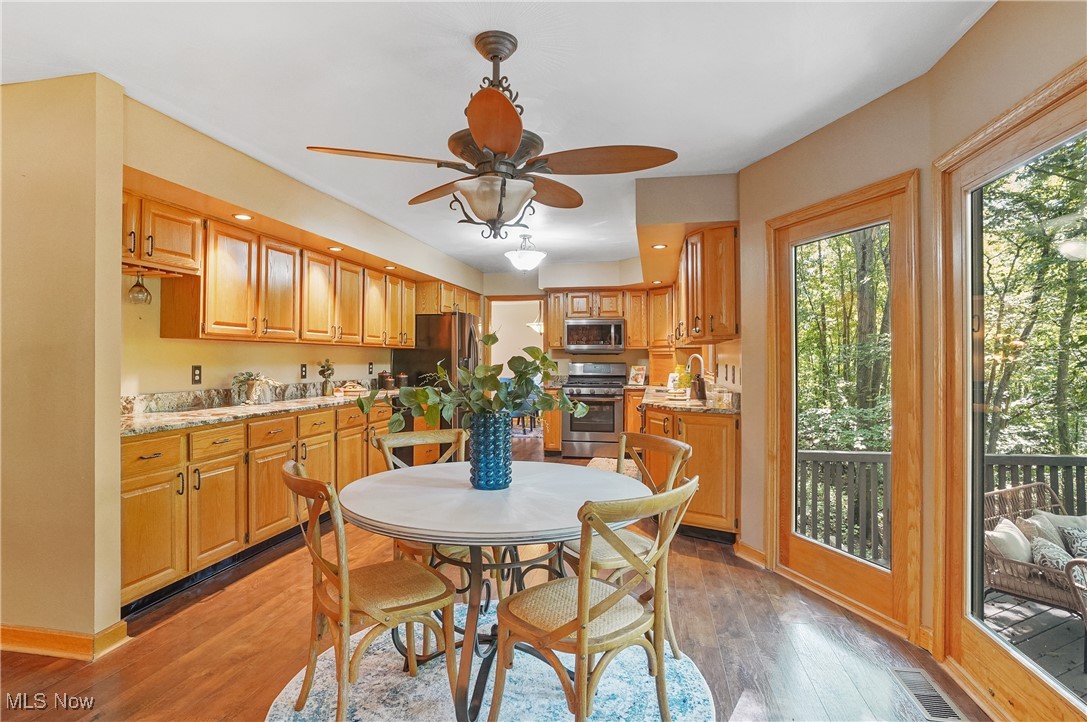 370 Wilcox Road Youngstown, OH 44515 - Photo 12 of 49 Dining room featuring light wood finished floors and ceiling fan