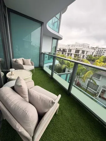 a view of swimming pool with outdoor seating and city view