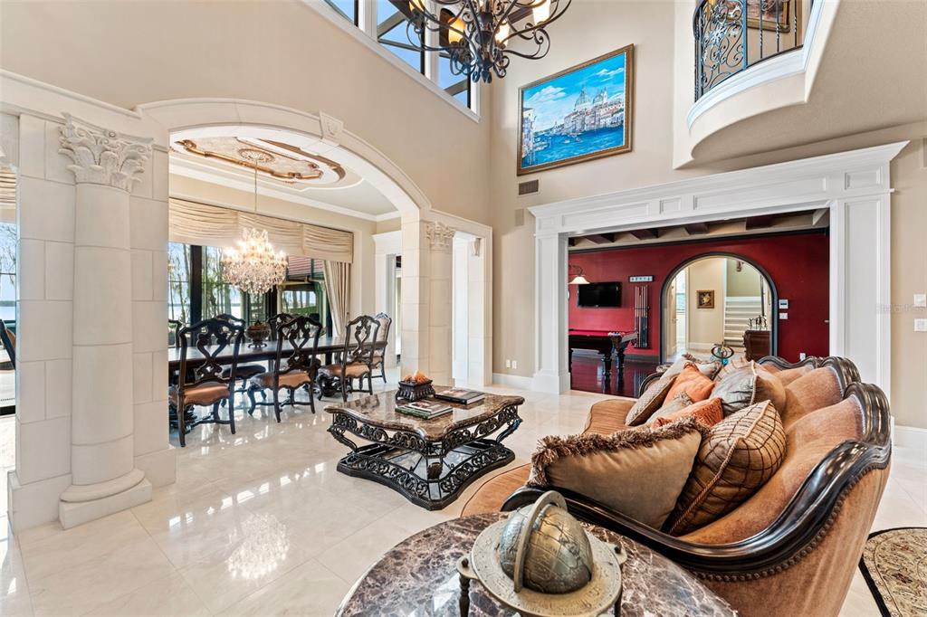 5070 Down Point Lane Windermere, FL 34786 - Photo 12 of 57 a living room with furniture and a large window