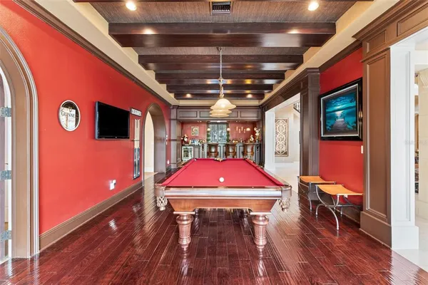 a long hallway with furniture and a large window