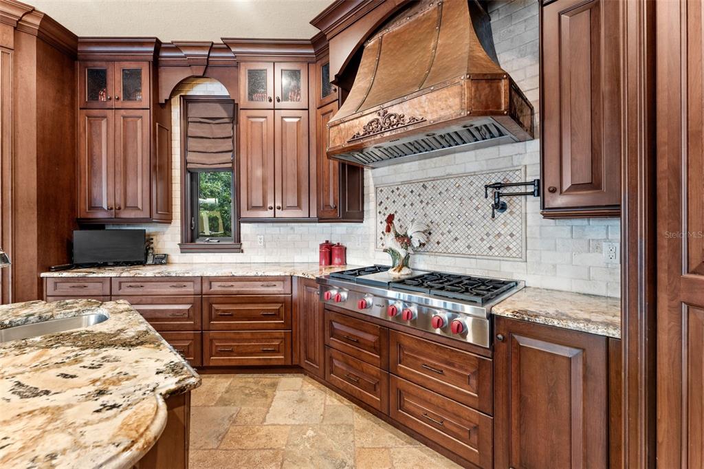 5070 Down Point Lane Windermere, FL 34786 - Photo 25 of 57 a kitchen with stainless steel appliances granite countertop a stove and a sink