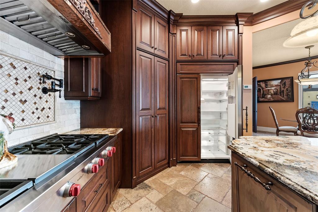 5070 Down Point Lane Windermere, FL 34786 - Photo 26 of 57 a kitchen with granite countertop a stove and a refrigerator