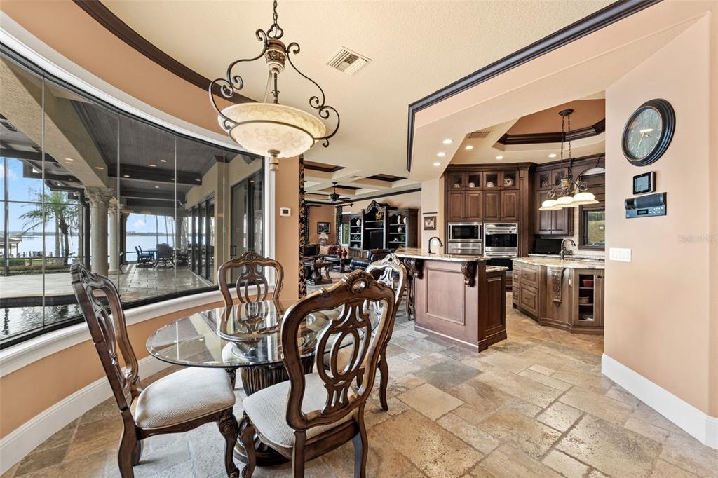 5070 Down Point Lane Windermere, FL 34786 - Photo 27 of 57 a view of a dining room with furniture and kitchen view